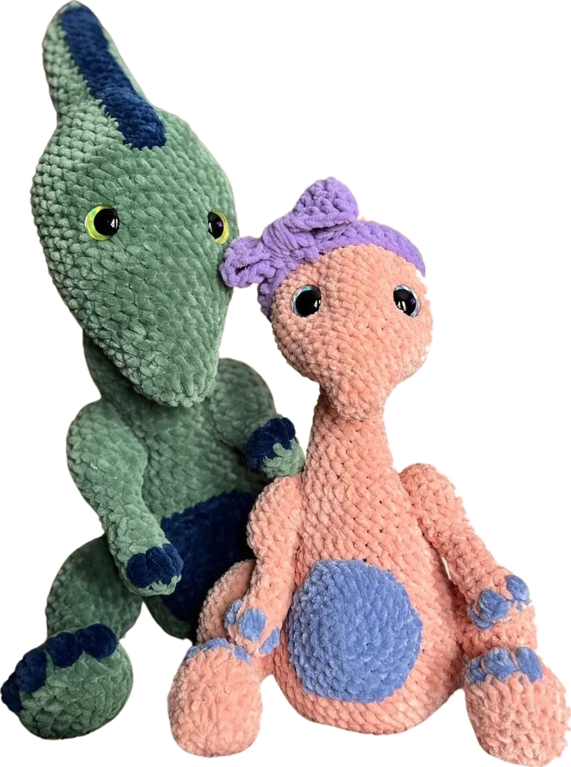 Presley the Parasaurolophus, crocheted in green and in peach velvet yarn